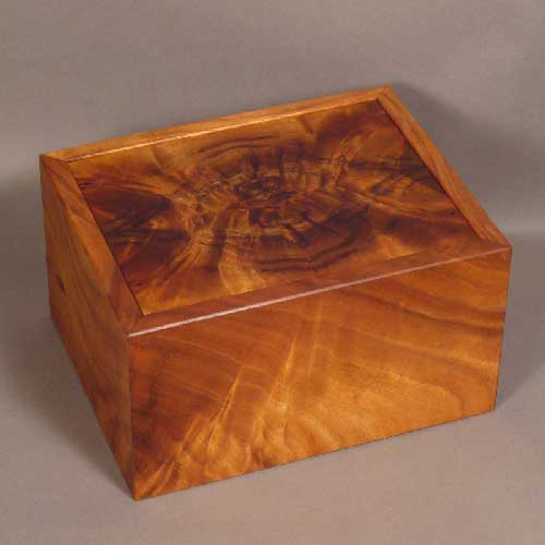 urn with bookmatched curly koa 